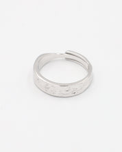 A simple silver ring with a textured surface, displayed against a white background.