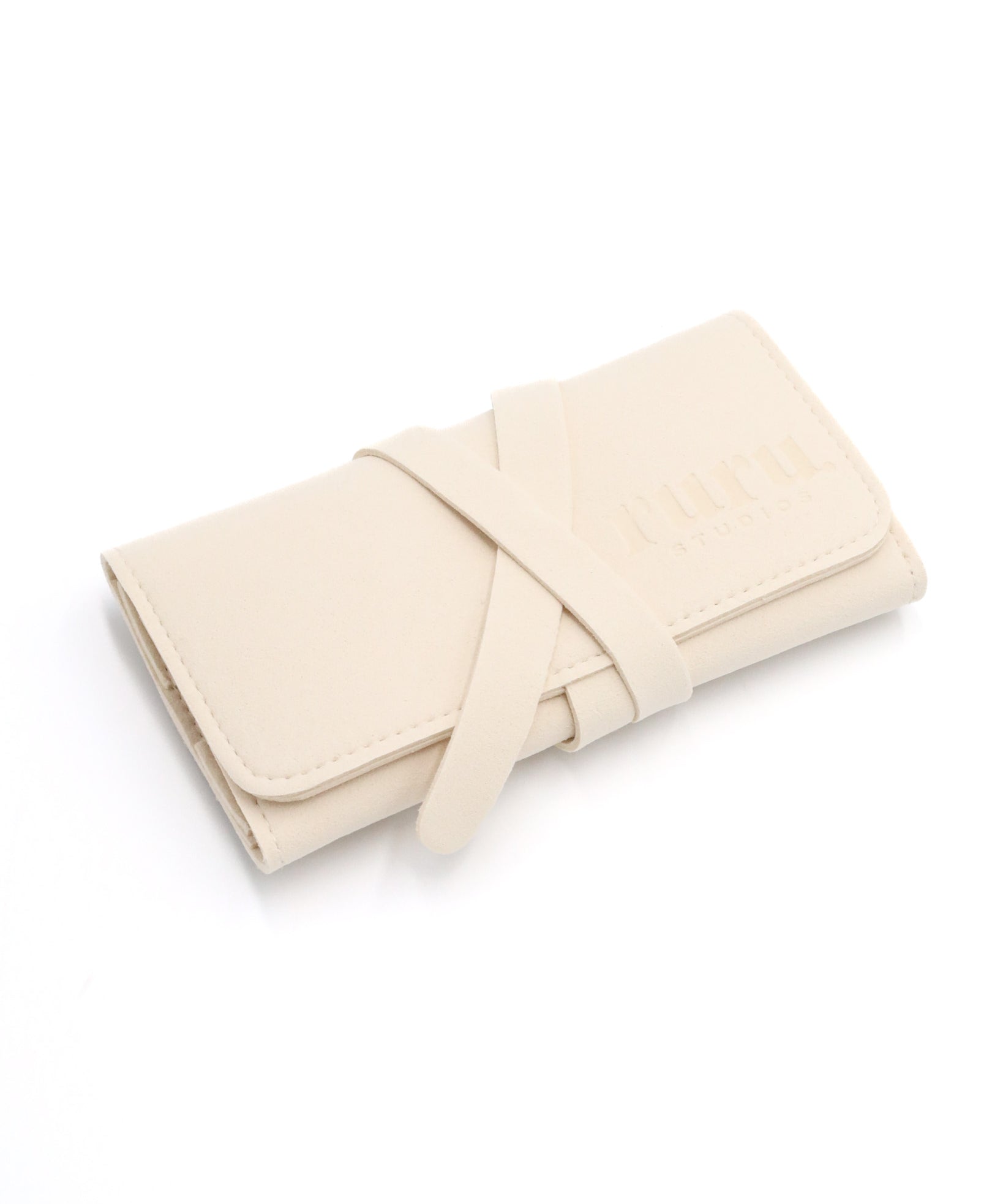 A beige travel case with a tie-up closure, designed for storing jewelry.