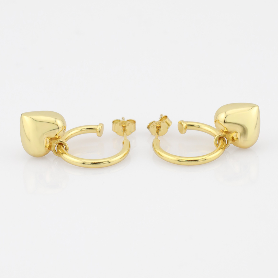 Gold hoop earrings on a white background