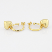Gold hoop earrings on a white background