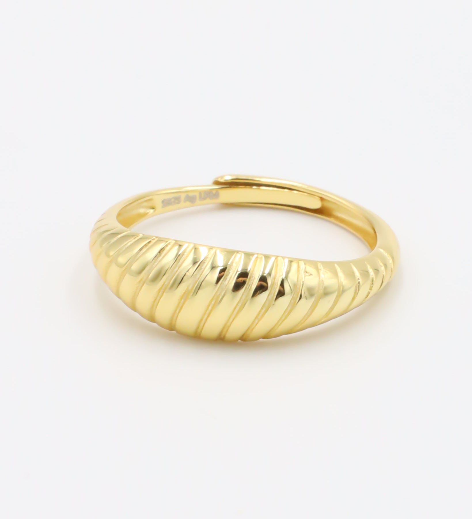 A gold-plated, recycled 925 sterling silver ring with a textured, adjustable band.