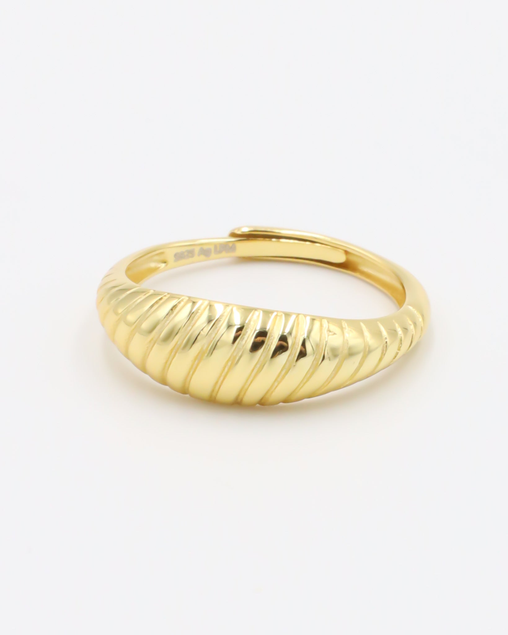 A gold-plated, recycled 925 sterling silver ring with a textured, adjustable band.