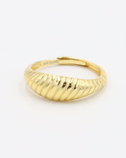 A gold-plated, recycled 925 sterling silver ring with a textured, adjustable band.