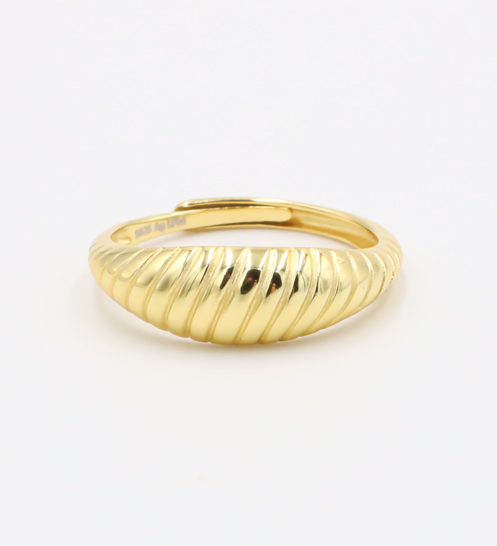 A gold-plated, recycled 925 sterling silver ring with a textured, adjustable band.