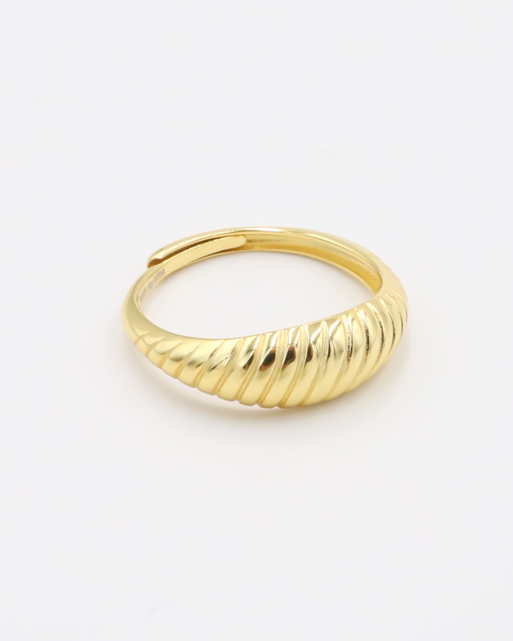 A gold-plated, recycled 925 sterling silver ring with a textured, adjustable band.
