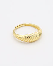 A gold-plated, recycled 925 sterling silver ring with a textured, adjustable band.