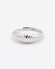 A rhodium-plated, recycled 925 sterling silver ring with a textured, adjustable band.