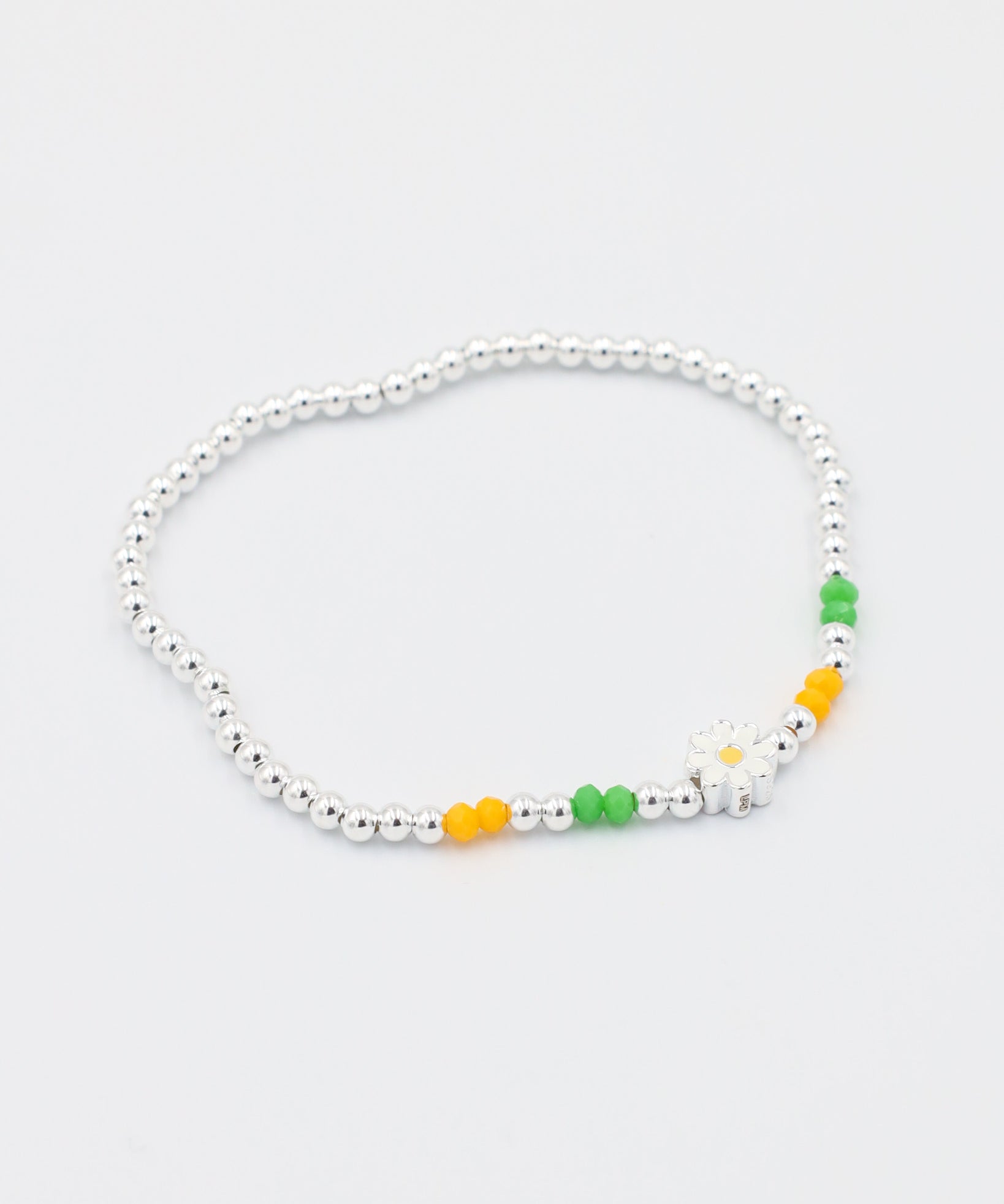 Side view of the adjustable Azalea bracelet with sterling silver beads and colorful accents, perfect for a versatile and fun look.