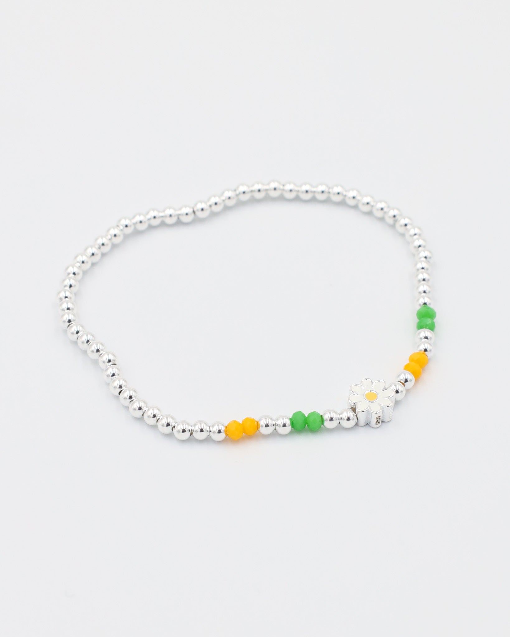 Side view of the adjustable Azalea bracelet with sterling silver beads and colorful accents, perfect for a versatile and fun look.