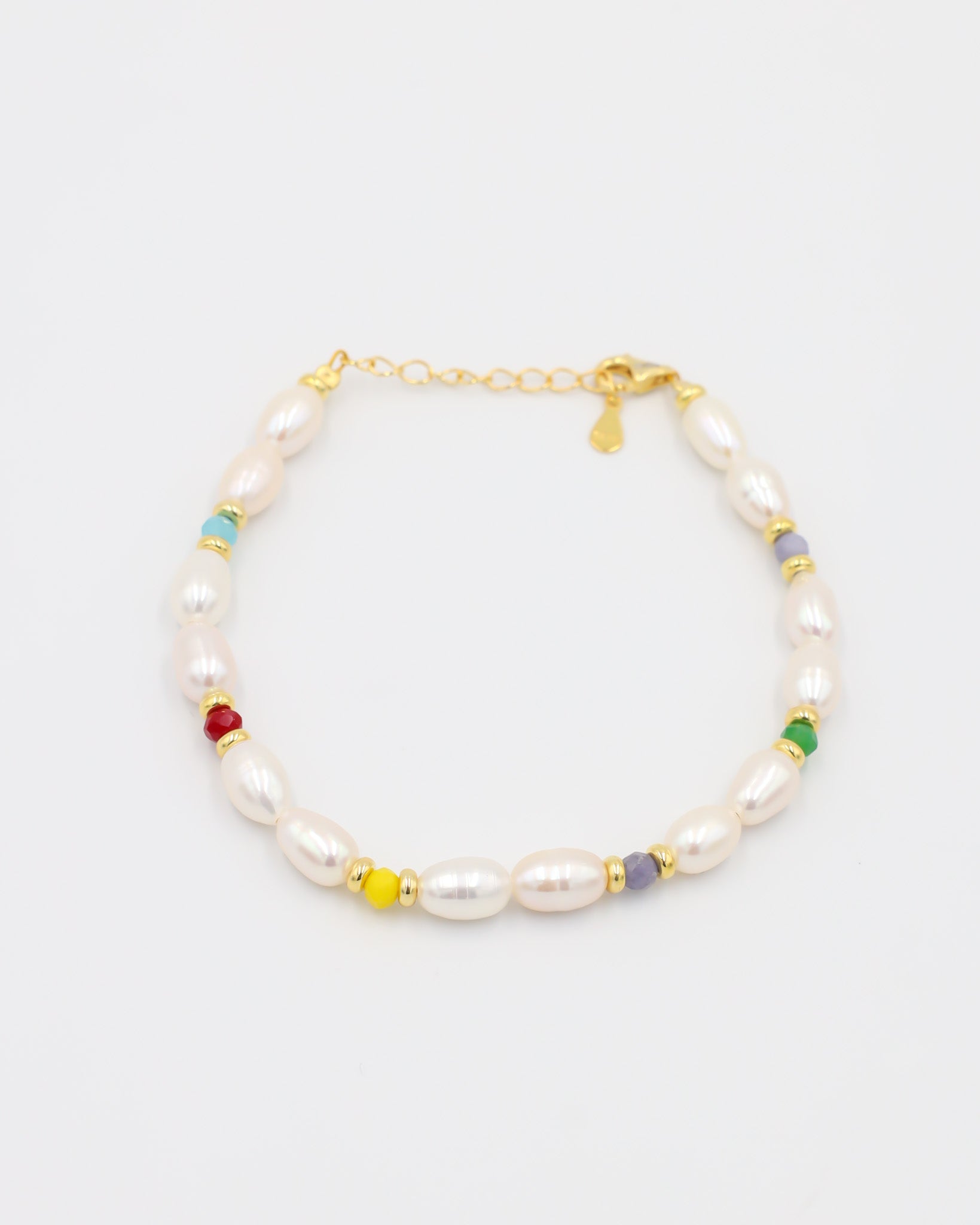Adjustable gold-plated sterling silver pearl bracelet with colorful beads, Moe Gold, angled view.
