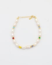 Adjustable gold-plated sterling silver pearl bracelet with colorful beads, Moe Gold, top view.