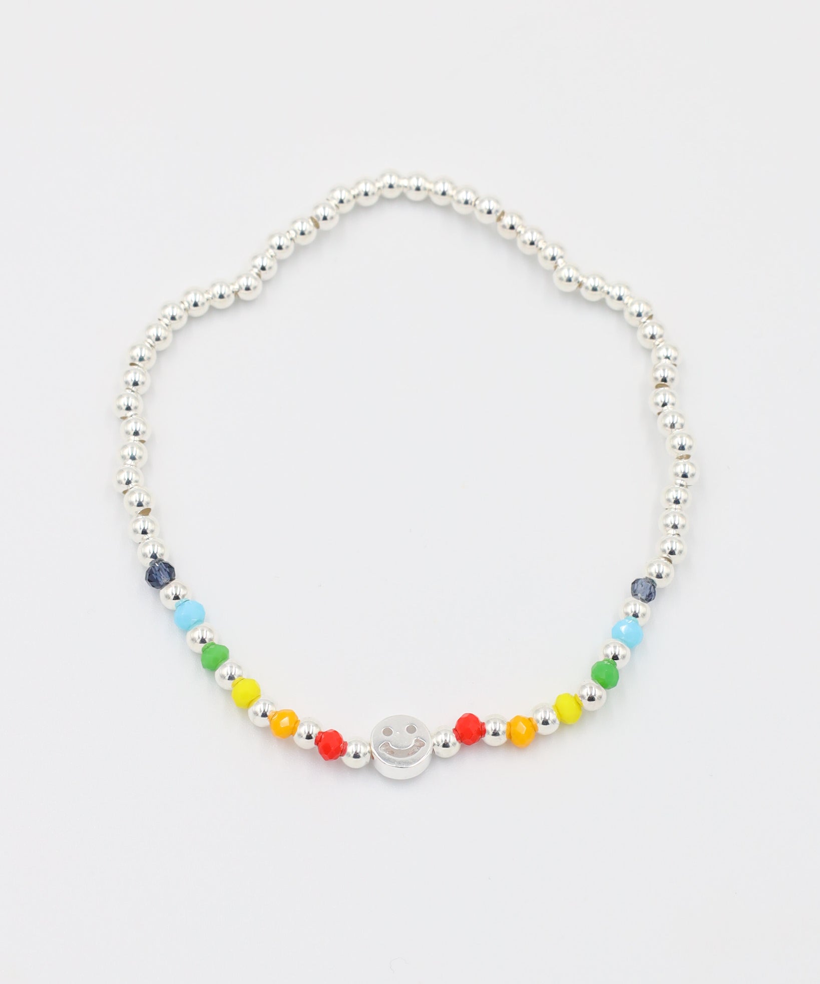 Adjustable sterling silver Pietro bracelet with a smiley charm, top view with colorful accent beads.