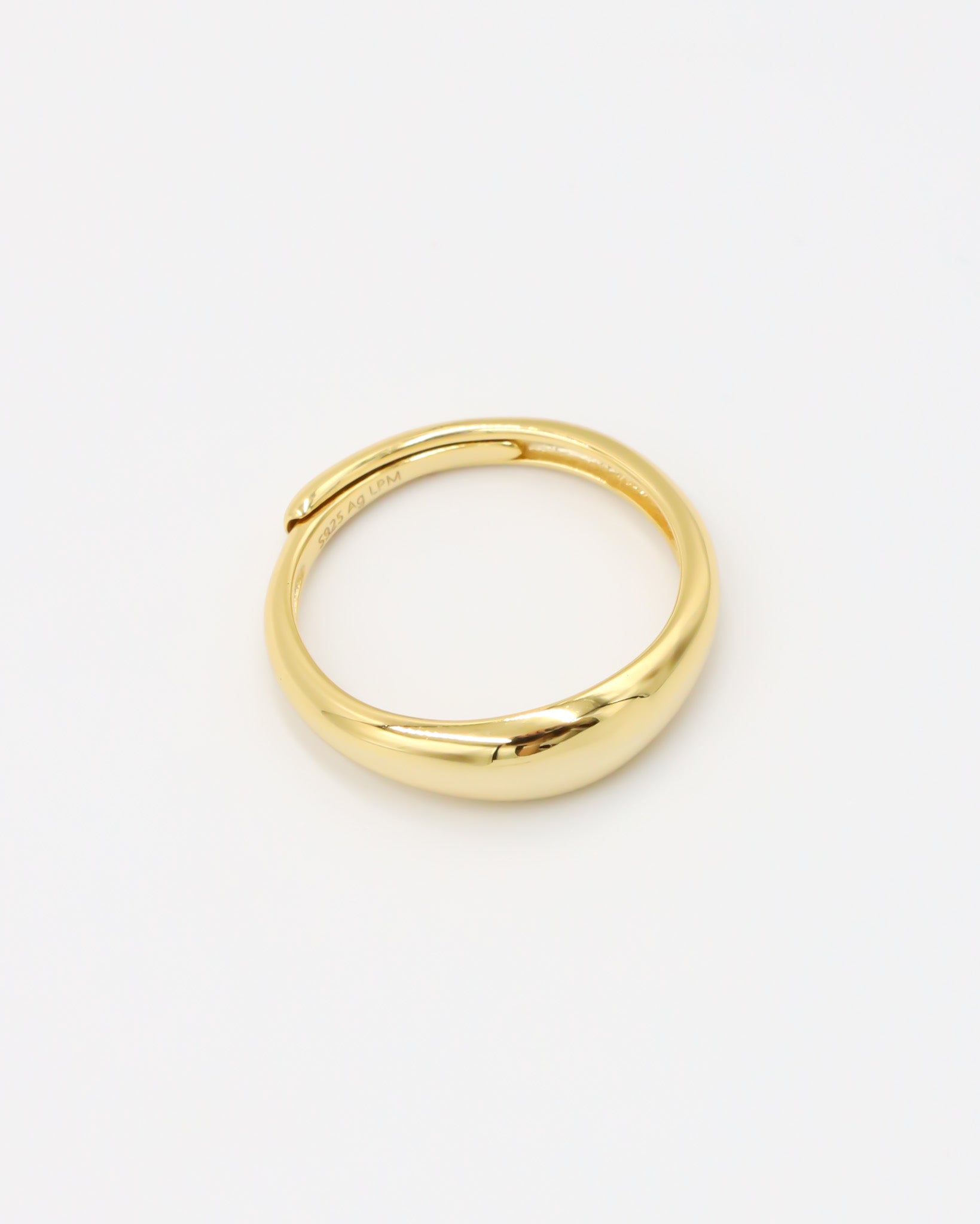 Aiden gold-plated sterling silver ring, adjustable, angled view, smooth polished finish.