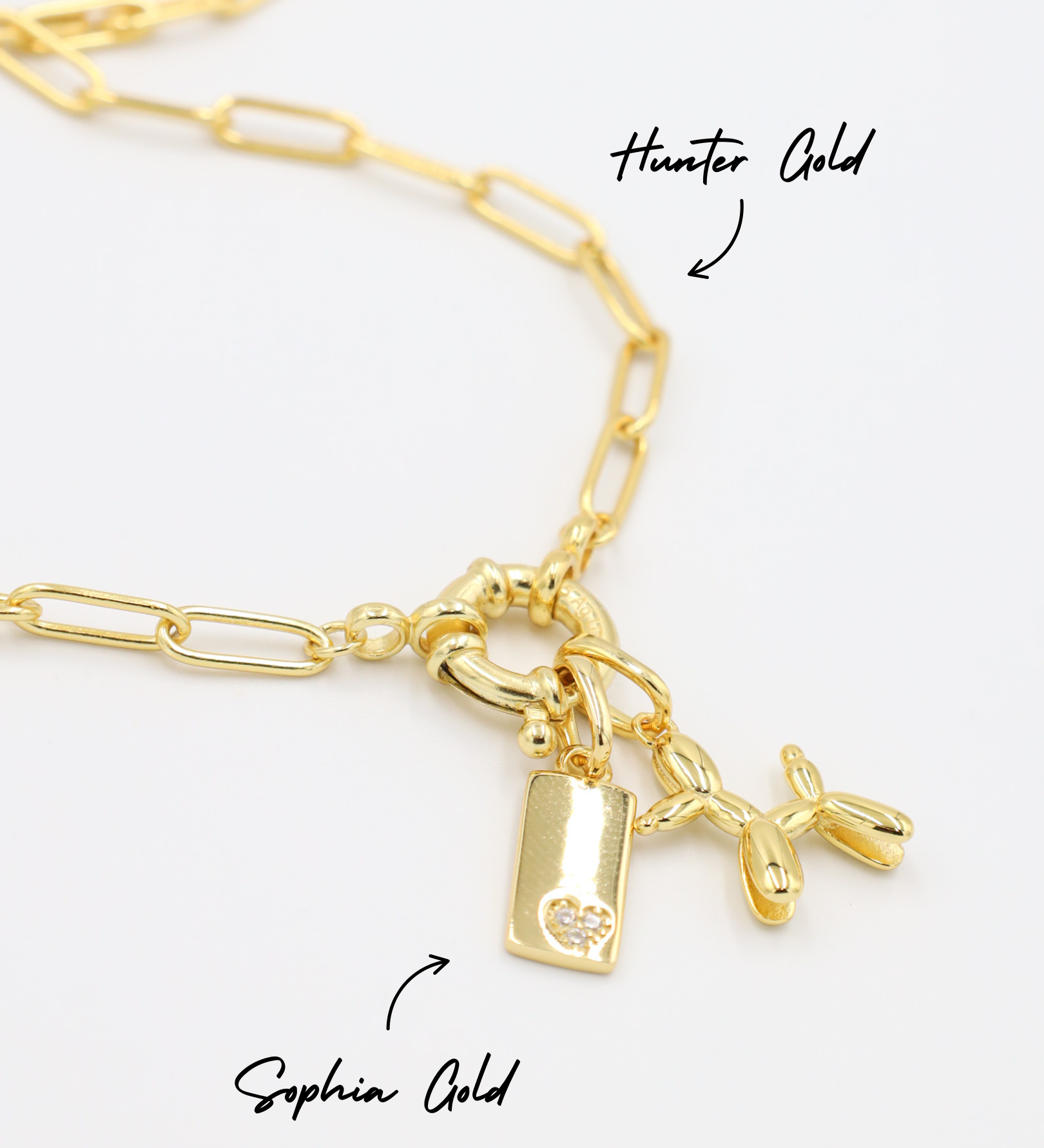 Hunter Gold chain necklace adorned with Sophia Gold pendant featuring a small heart detail and a Balloon Dog Gold pendant, all made of gold-plated 925 sterling silver.