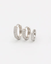 Three sizes of Billie hoop earrings in silver with zirconia stones, displayed from a front view. Sizes shown: S, M, and L.