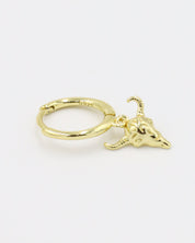 A single gold-plated sterling silver hoop earring with a bull skull charm.