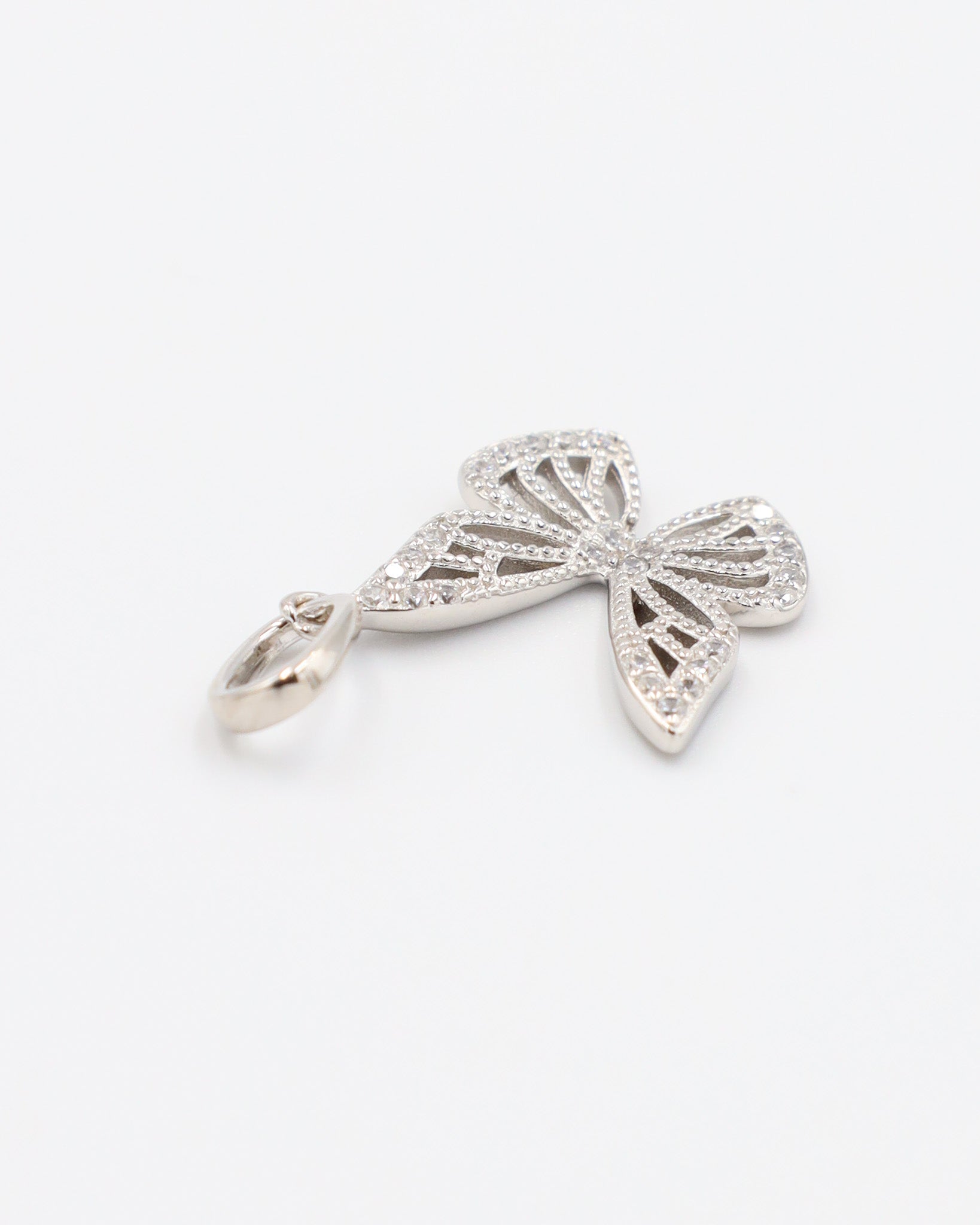 Butterfly Silver pendant made from rhodium-plated 925 sterling silver, adorned with zirconia stones in a flat lay style.