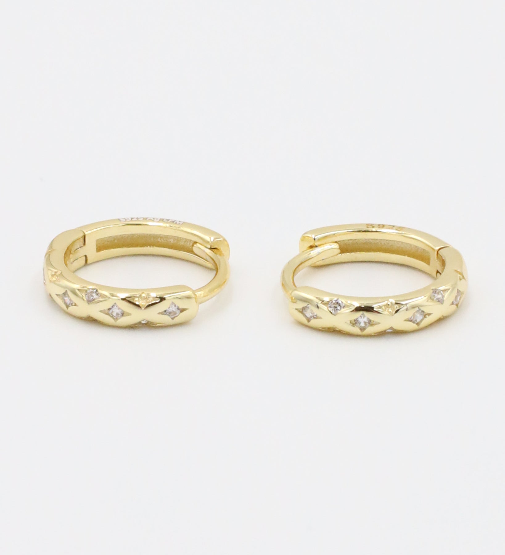 Cecilia gold-plated sterling silver huggie hoop earring pair with delicate stone details.