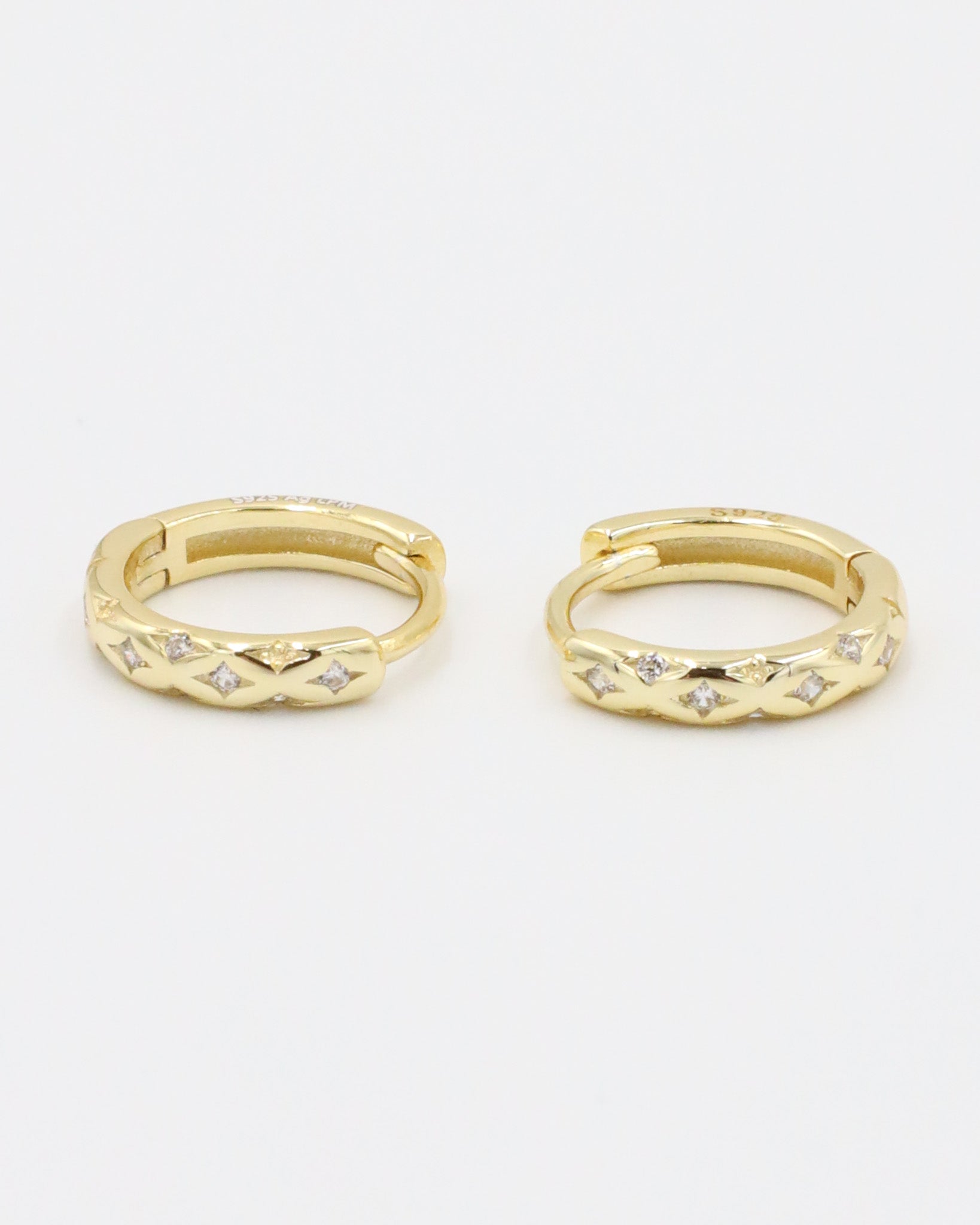 Cecilia gold-plated sterling silver huggie hoop earring pair with delicate stone details.