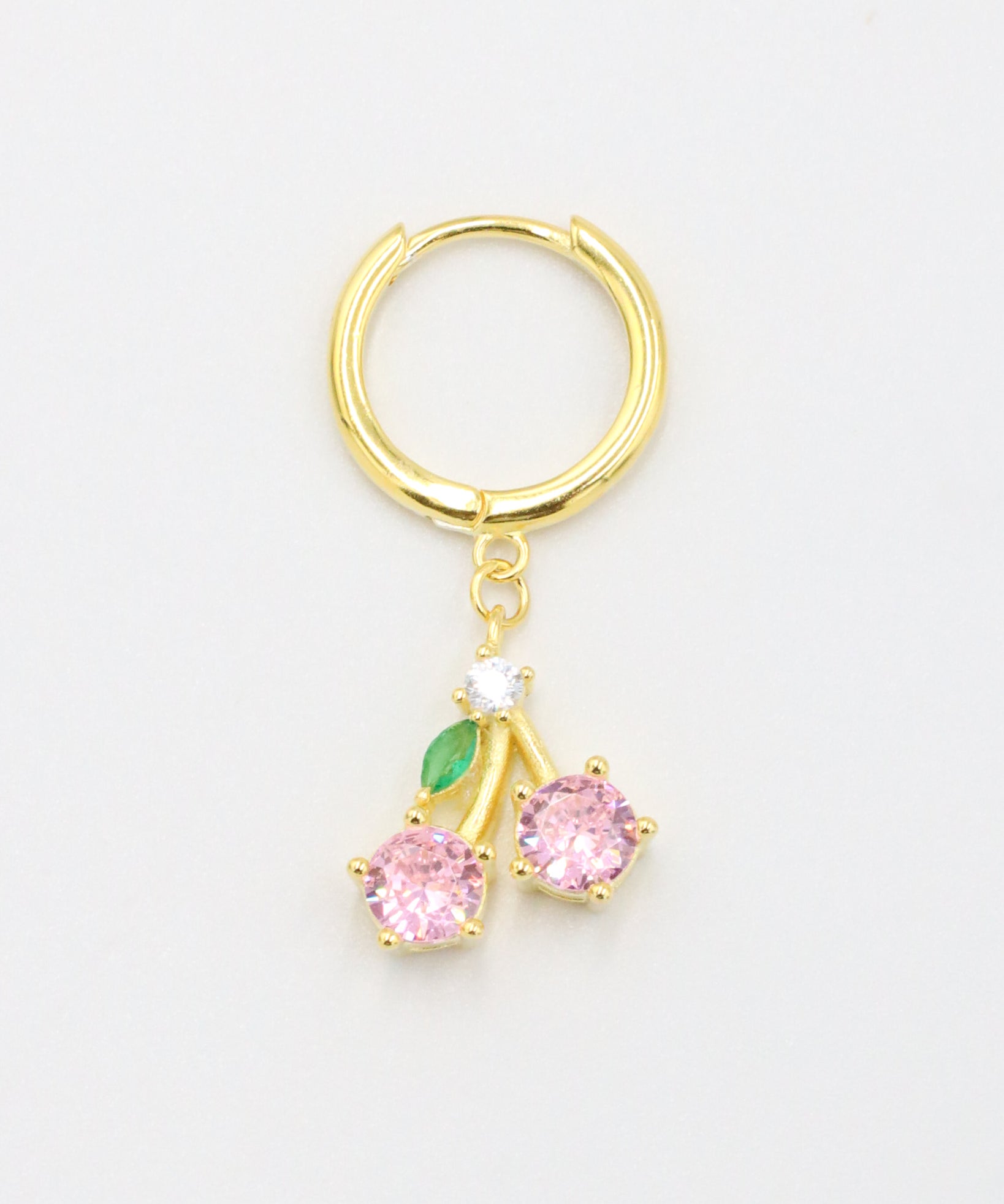 Single gold-plated sterling silver earring with two pink zirconia stones and green leaf detail, named Cherry.