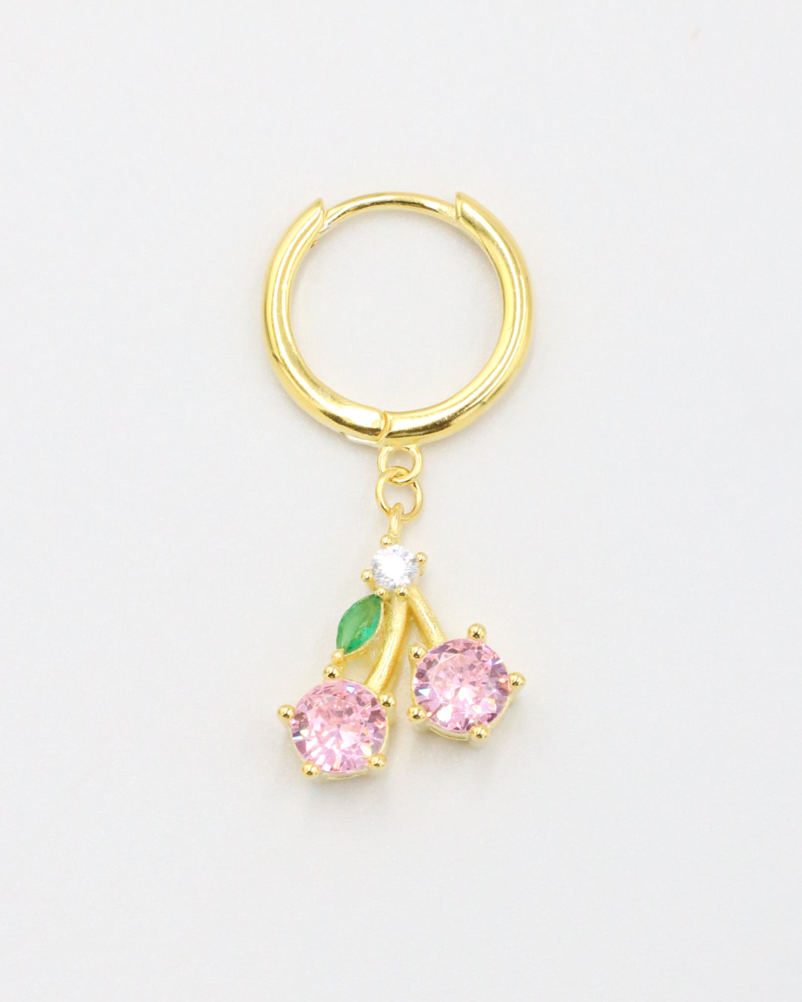 Single gold-plated sterling silver earring with two pink zirconia stones and green leaf detail, named Cherry.