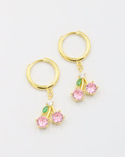 Gold-plated sterling silver earrings with two pink zirconia stones and green leaf detail, named Cherry.