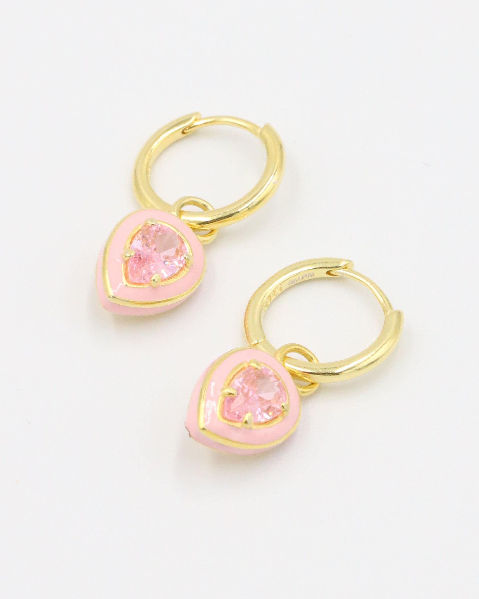 A pair of Cindy Pink earrings made from gold-plated sterling silver, featuring pink zirconia stones set in a teardrop shape with enamel details.