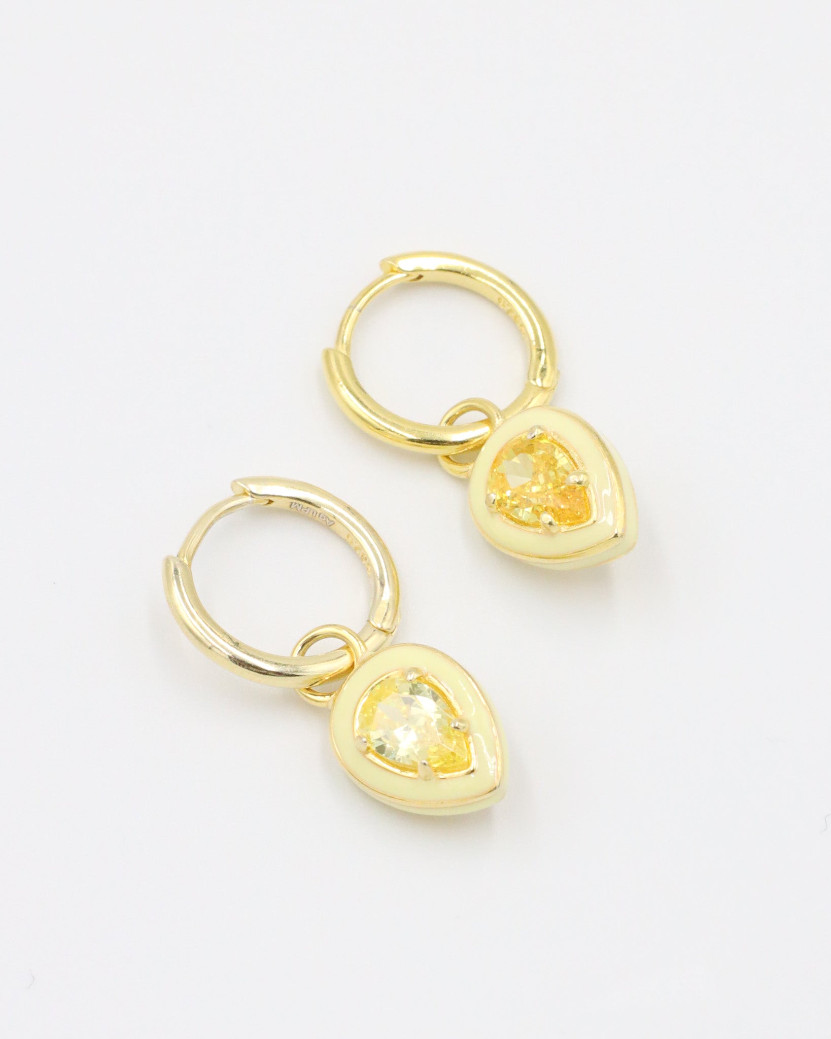 Gold-plated sterling silver earrings with yellow zirconia stones and enamel detailing, displayed as a pair.