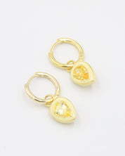 Gold-plated sterling silver earrings with yellow zirconia stones and enamel detailing, displayed as a pair.