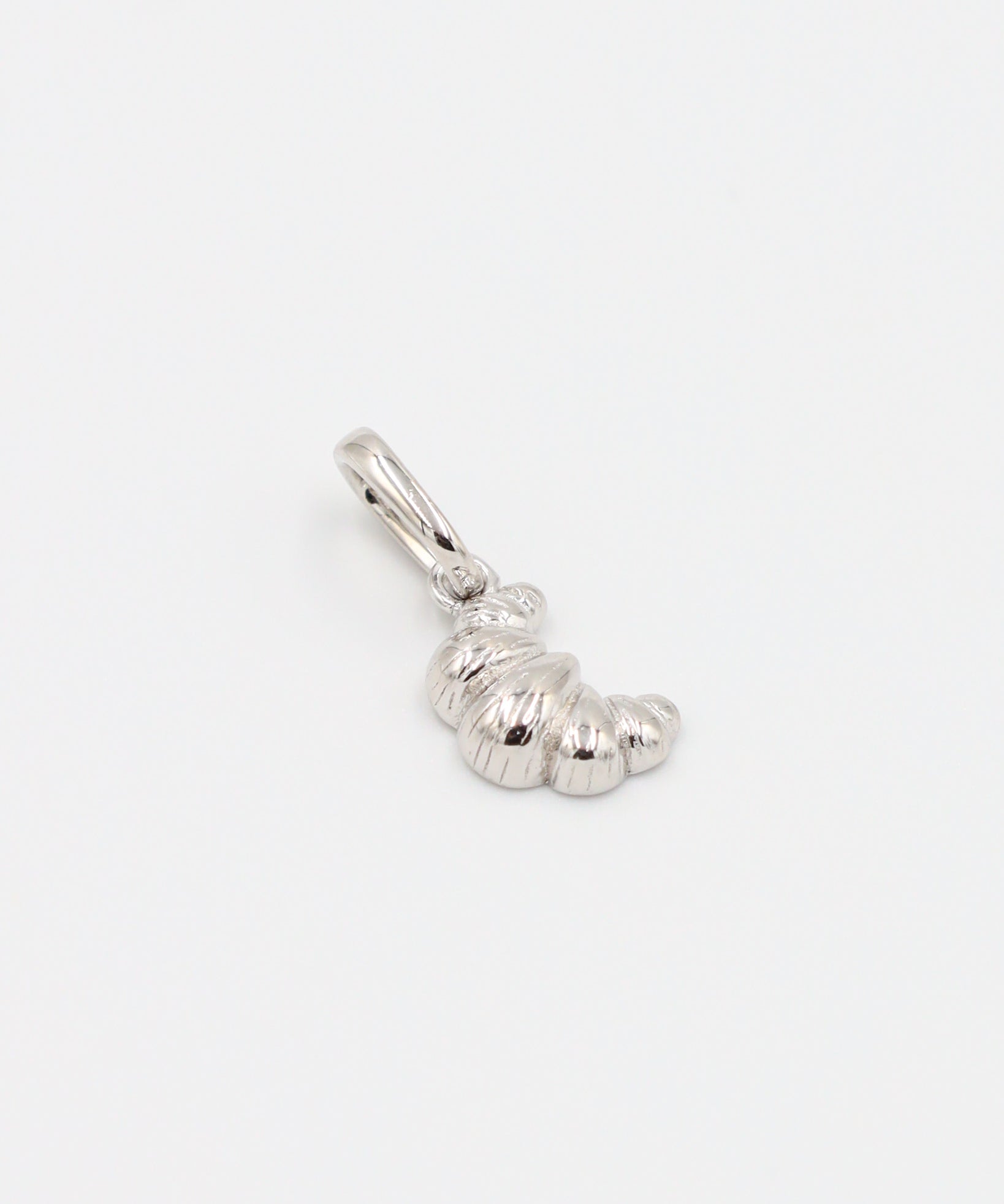 Croissant Silver pendant made from rhodium-plated 925 sterling silver, laid flat to display the details.