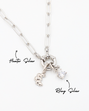 Hunter Silver necklace with Croissant Silver pendant and Riley Silver pendant featuring a sparkling stone.