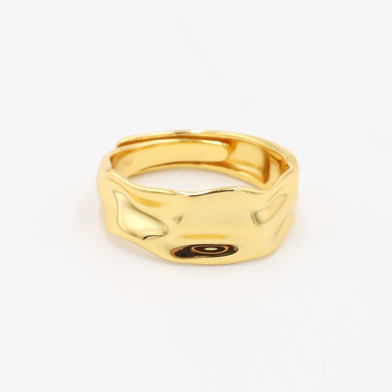 Daphne - adjustable gold-plated sterling silver ring with wavy texture, minimalist design, front view.