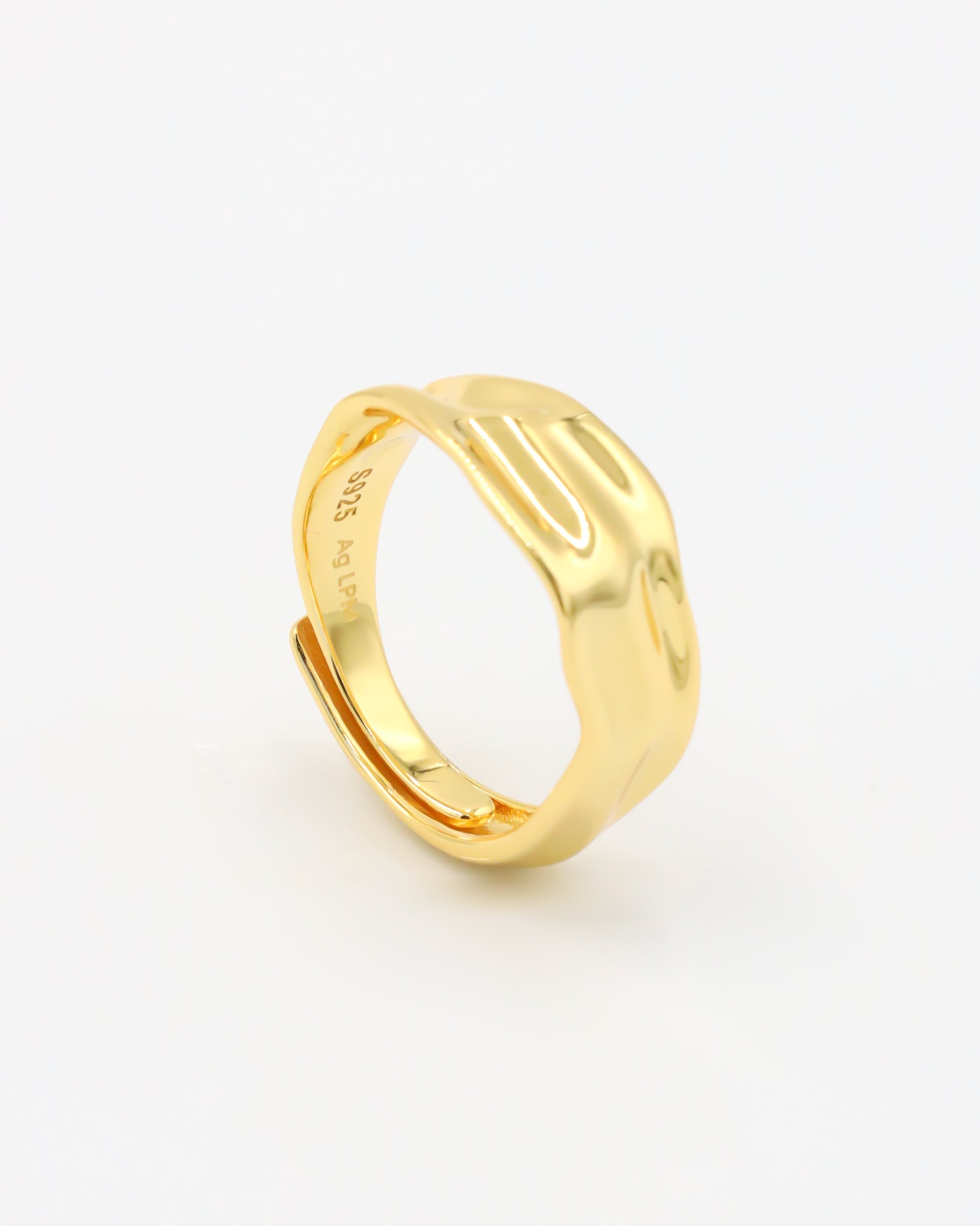 Daphne - adjustable gold-plated sterling silver ring with wavy texture, side view, minimalist design.