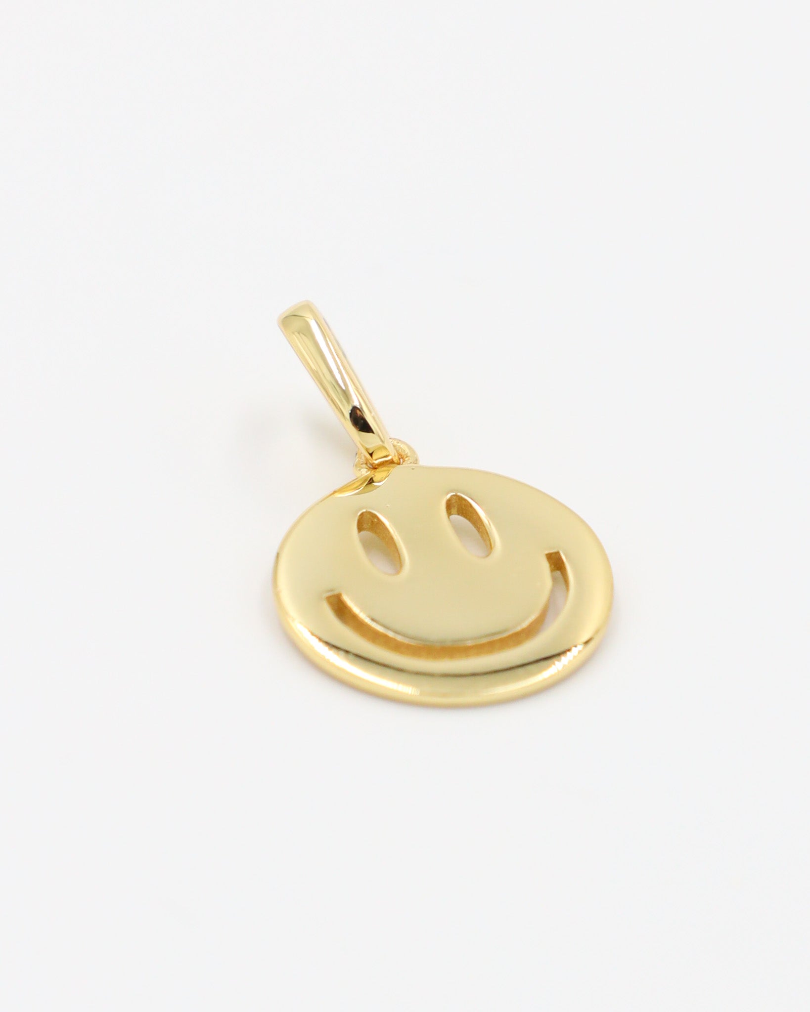 Side view of Flynn Gold smiley face pendant in gold-plated 925 sterling silver.