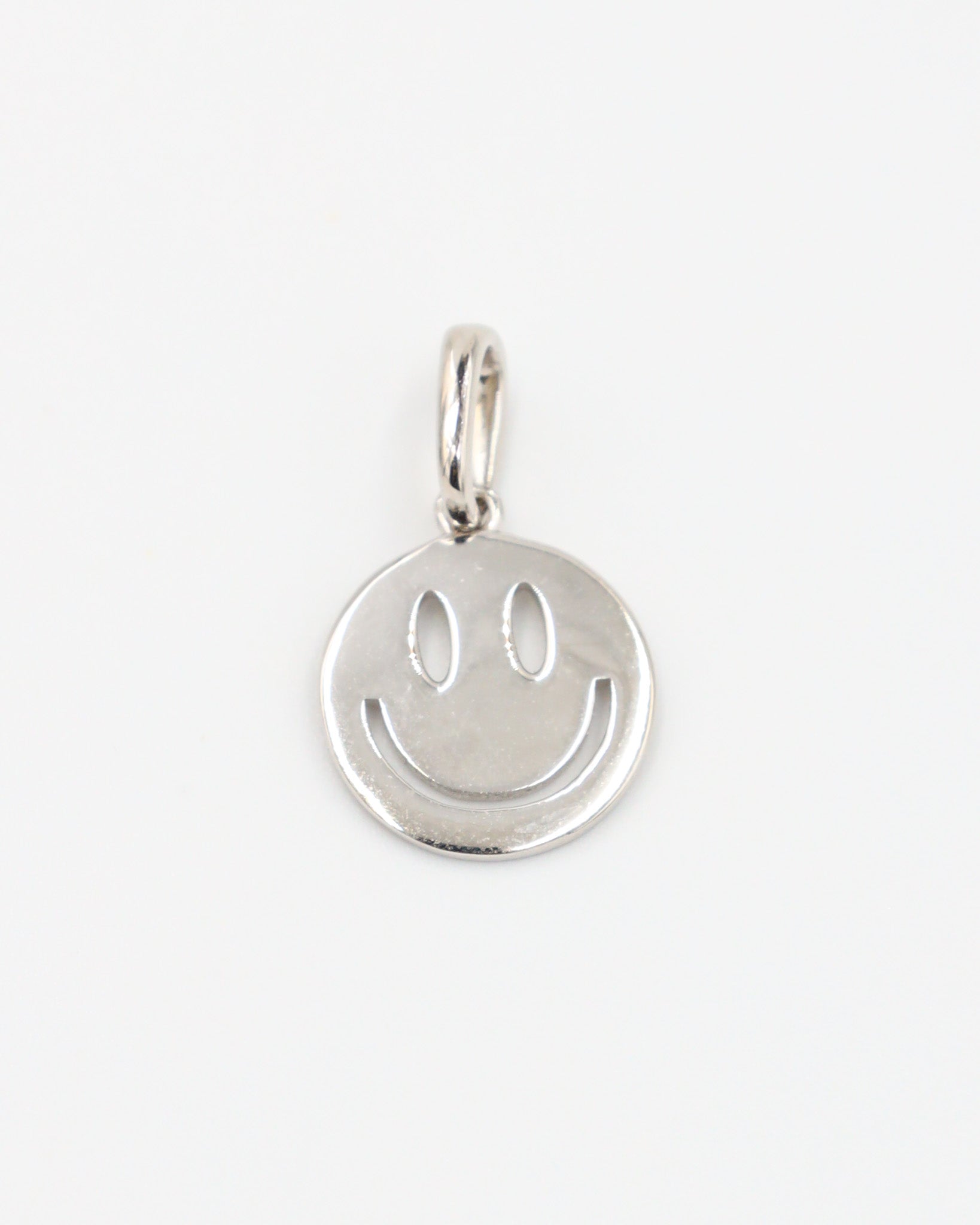 Flynn Silver pendant featuring a smiley face design crafted from rhodium-plated 925 sterling silver, shown from the front.