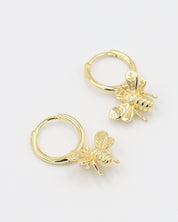 Gold-plated sterling silver hoop earrings with a bee charm, shown as a pair.