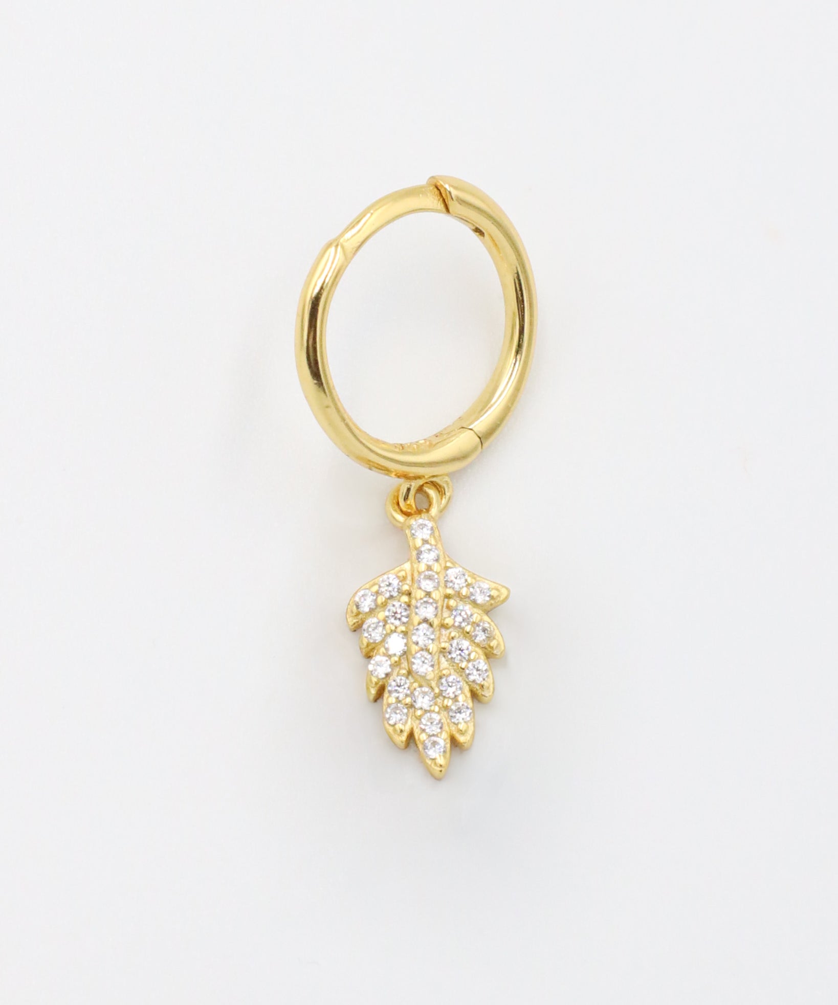 Gold-plated sterling silver hoop earring with leaf design and zirconia stones, front view