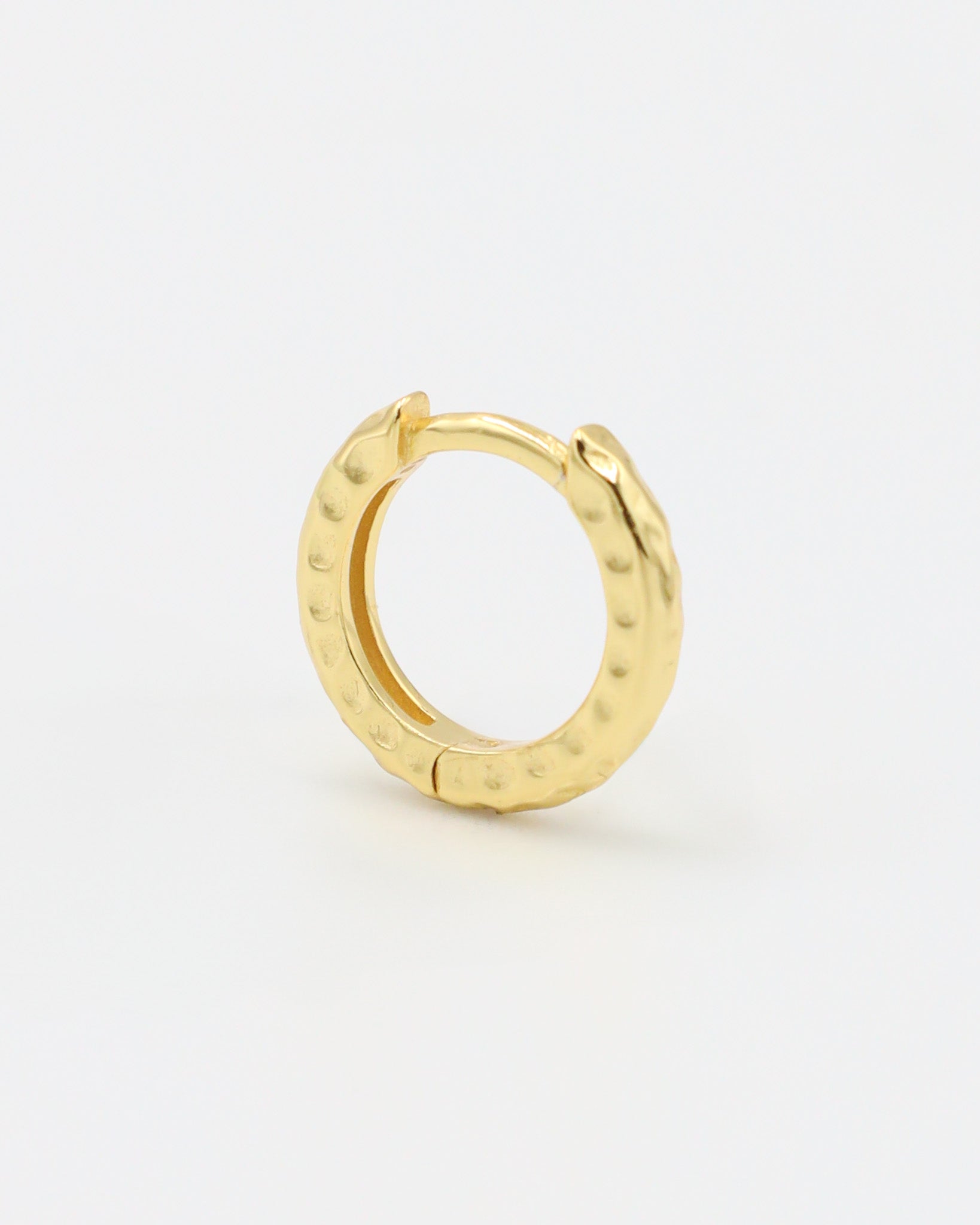 Side view of the gold-plated sterling silver Siranush huggie earring, showcasing its unique shape.