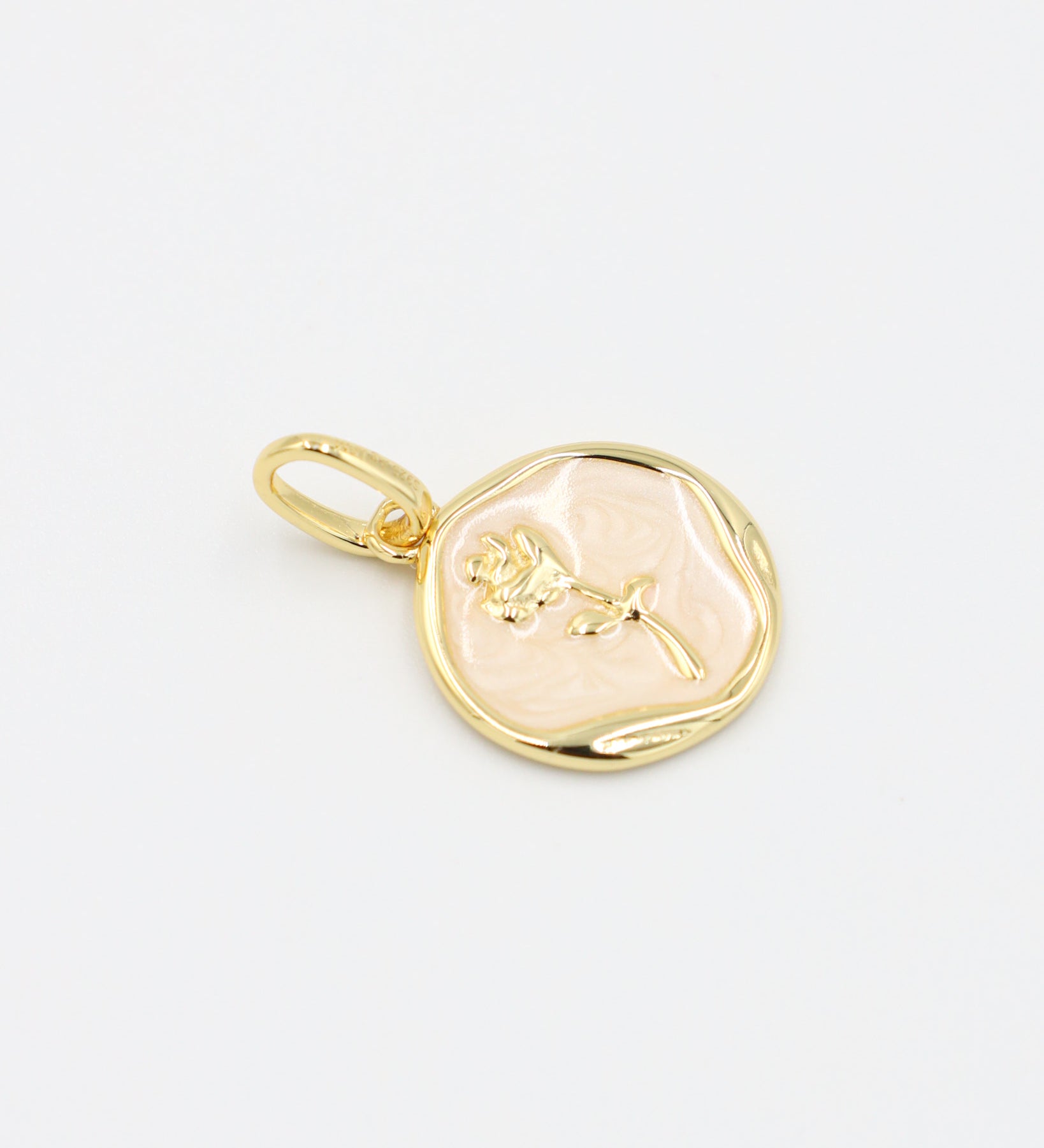 Flat display of the Gwendolyn Gold pendant showing its delicate flower detail, set in gold-plated 925 sterling silver.