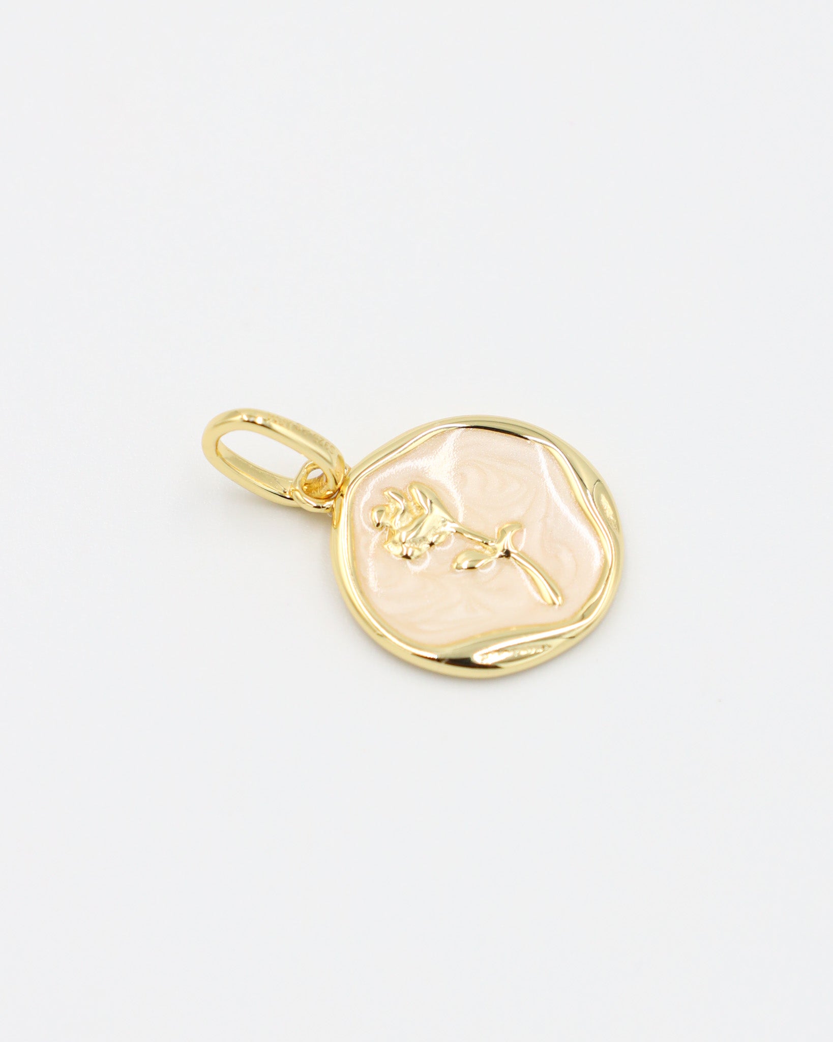 Flat display of the Gwendolyn Gold pendant showing its delicate flower detail, set in gold-plated 925 sterling silver.