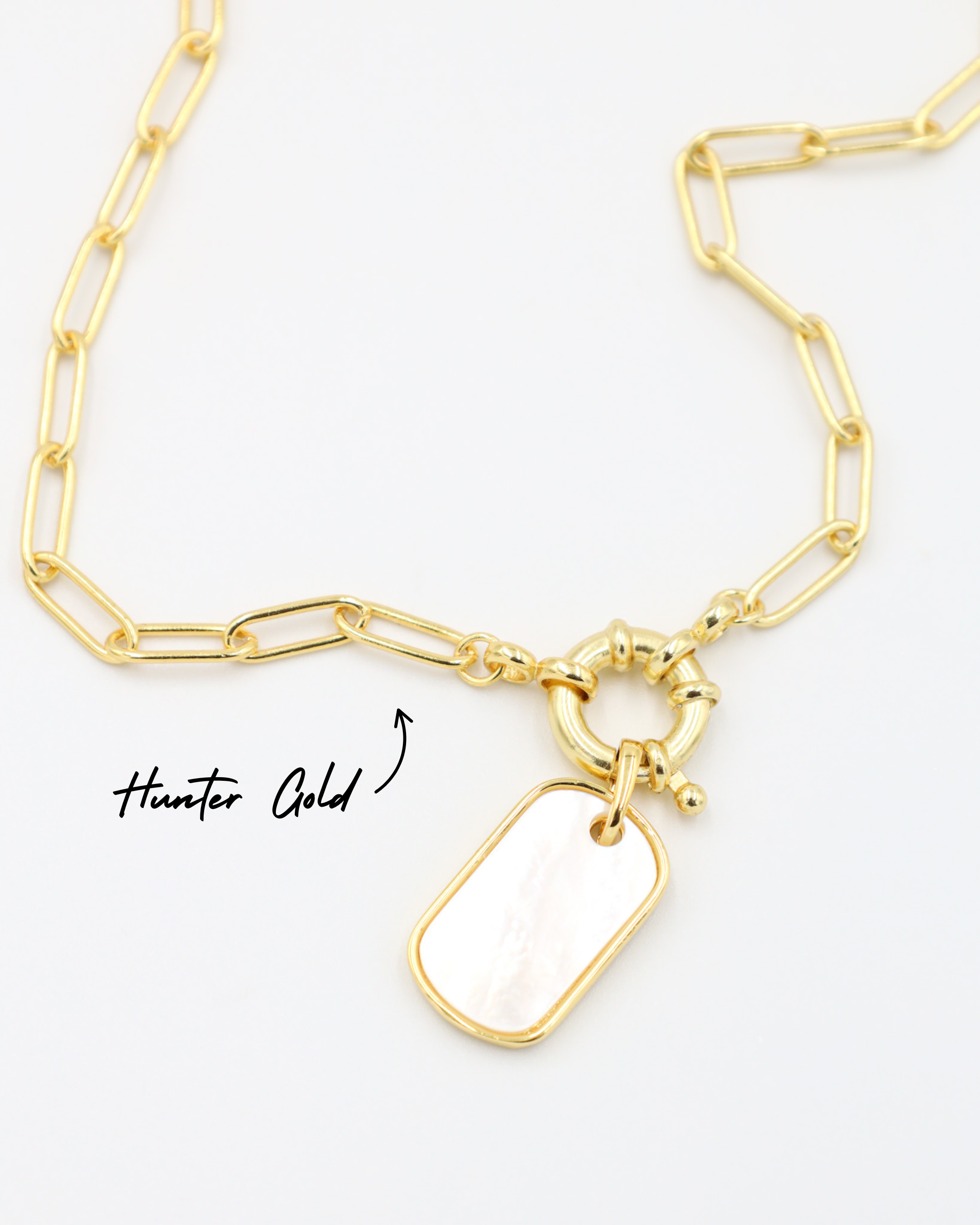 Hunter Gold necklace with Amara pendant, featuring a gold link chain and mother-of-pearl charm for a bold yet refined style.