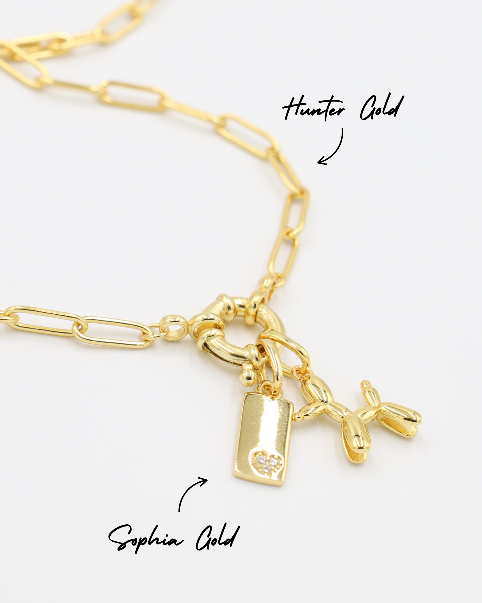 Hunter Gold chain necklace adorned with Sophia Gold pendant featuring a small heart detail and a Balloon Dog Gold pendant, all made of gold-plated 925 sterling silver.