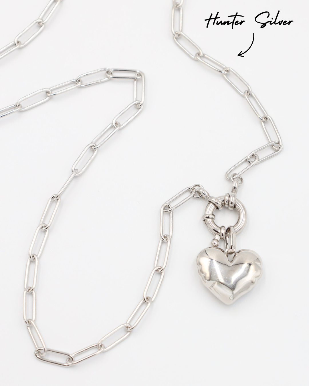 Hunter Silver chain necklace paired with the Bella Silver heart pendant, all crafted in rhodium-plated 925 sterling silver.