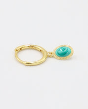 A single gold-plated sterling silver hoop earring with an oval turquoise charm, viewed from the side.
