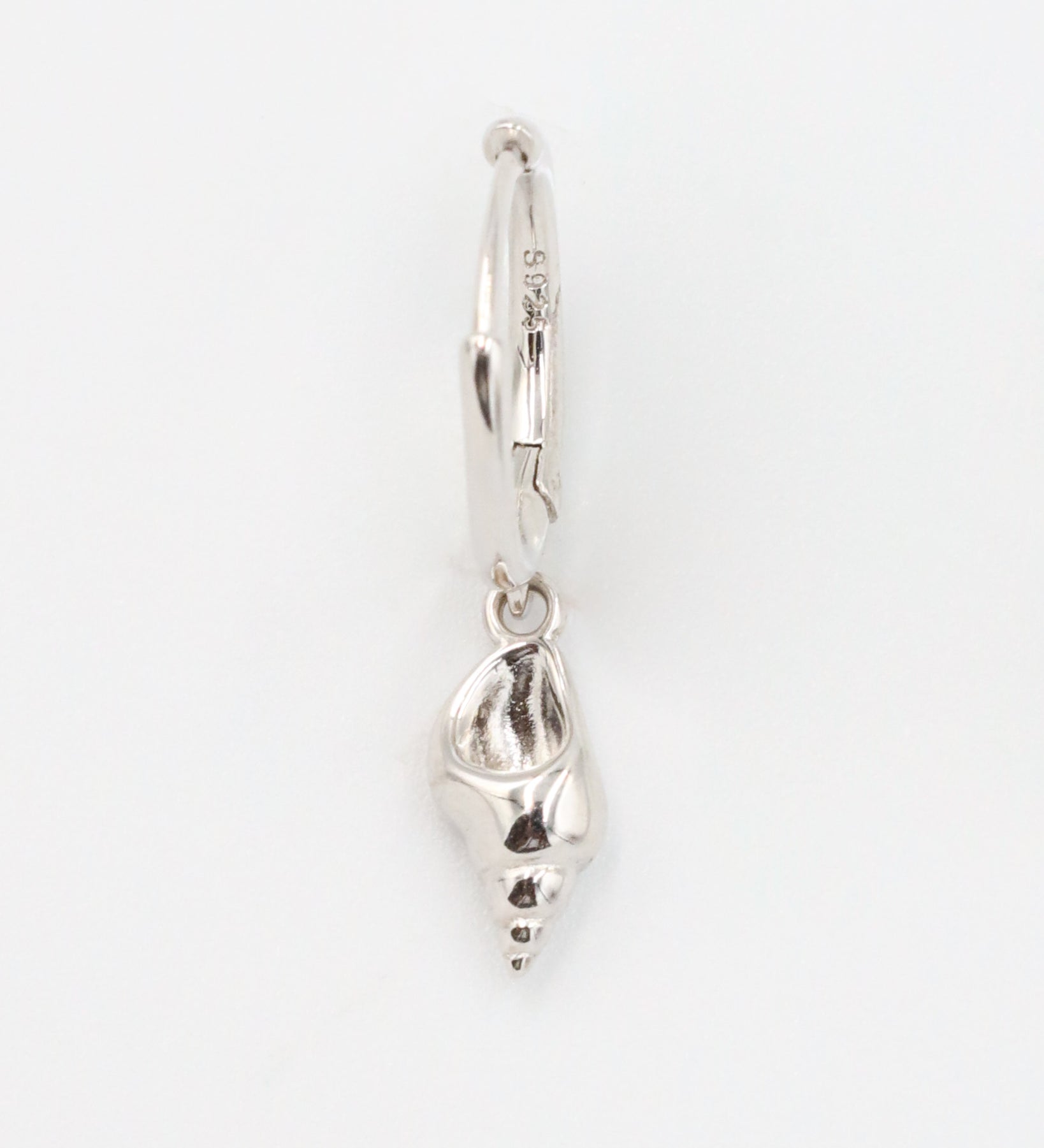 Front view of a single Maddy silver shell earring in 925 sterling silver with a shell pendant.