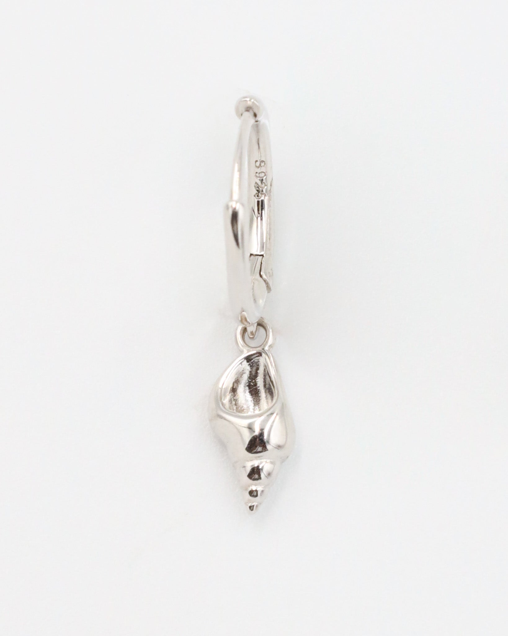 Front view of a single Maddy silver shell earring in 925 sterling silver with a shell pendant.