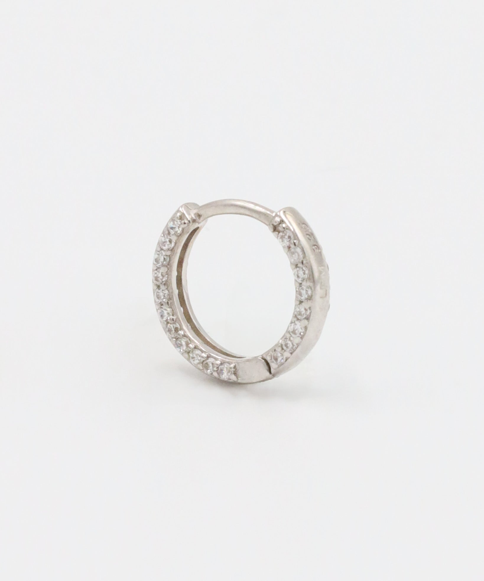 Stylish Mara sterling silver hoop earring featuring sparkling zirconia stones, designed for everyday elegance.