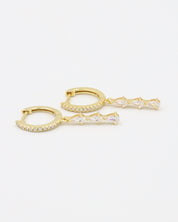 Micah gold drop earring with four teardrop-shaped zirconia stones and pavé hoop, front view.