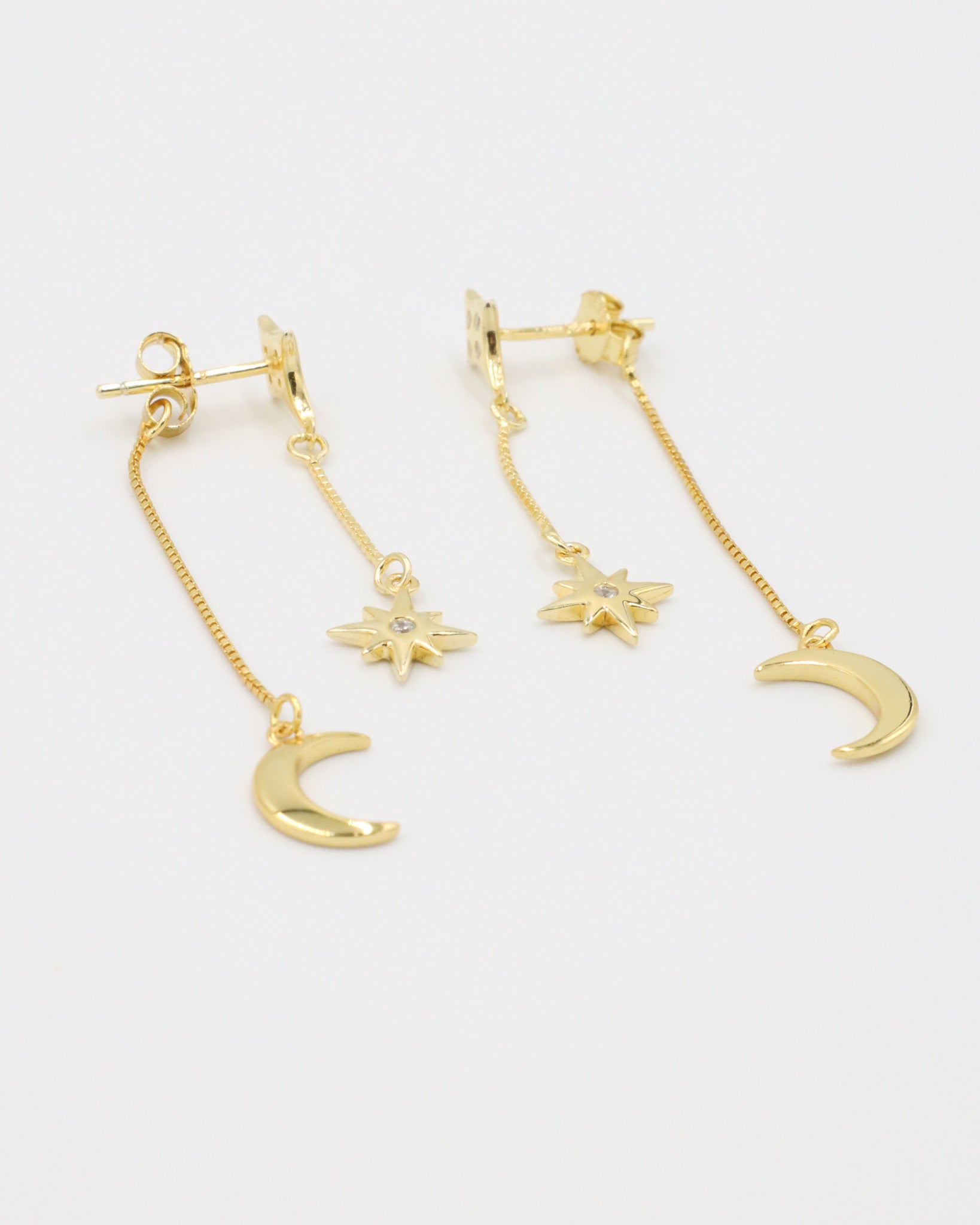 Single Reese earring in gold-plated sterling silver, featuring a delicate chain with a crescent moon and star detail.