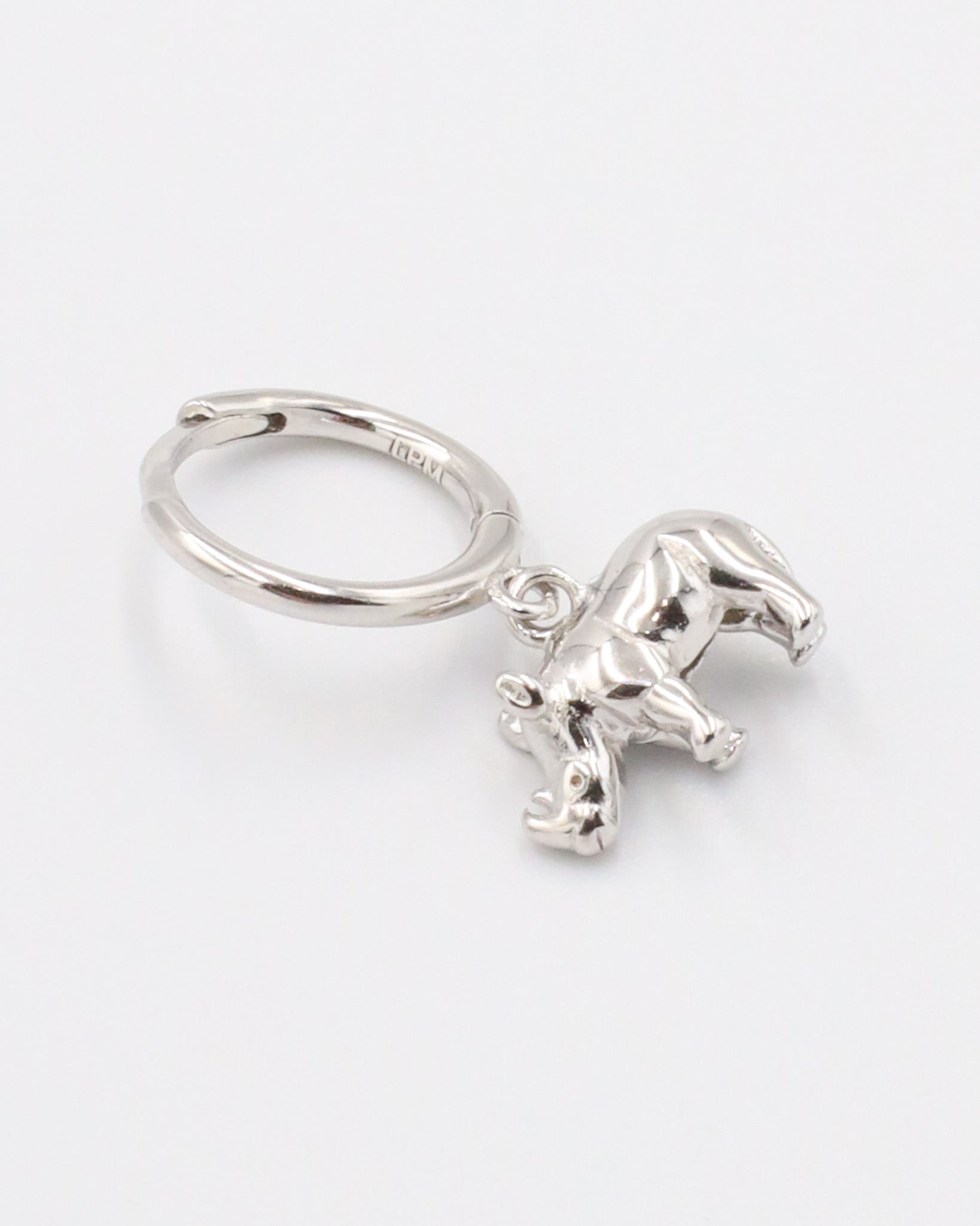 Sterling silver rhino hoop earring for the left ear.